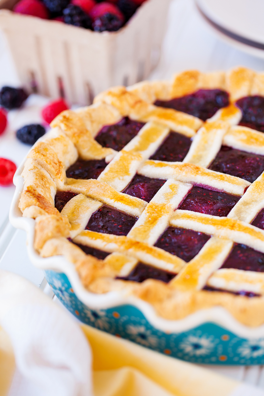 This Triple Berry Pie is bursting with berry flavor and is topped with a buttery golden crust! It's perfect for the holidays!