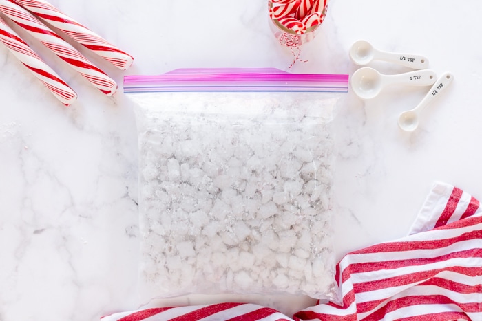 puppy chow mixture in ziploc bag with powdered sugar