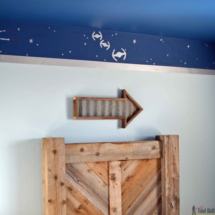 Make an easy DIY rustic arrow with free plans.  Add tin in the center for an industrial feel.