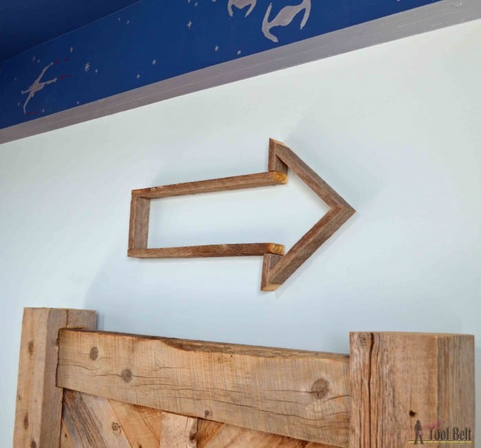 Make an easy DIY rustic arrow with free plans.  Add tin in the center for an industrial feel.