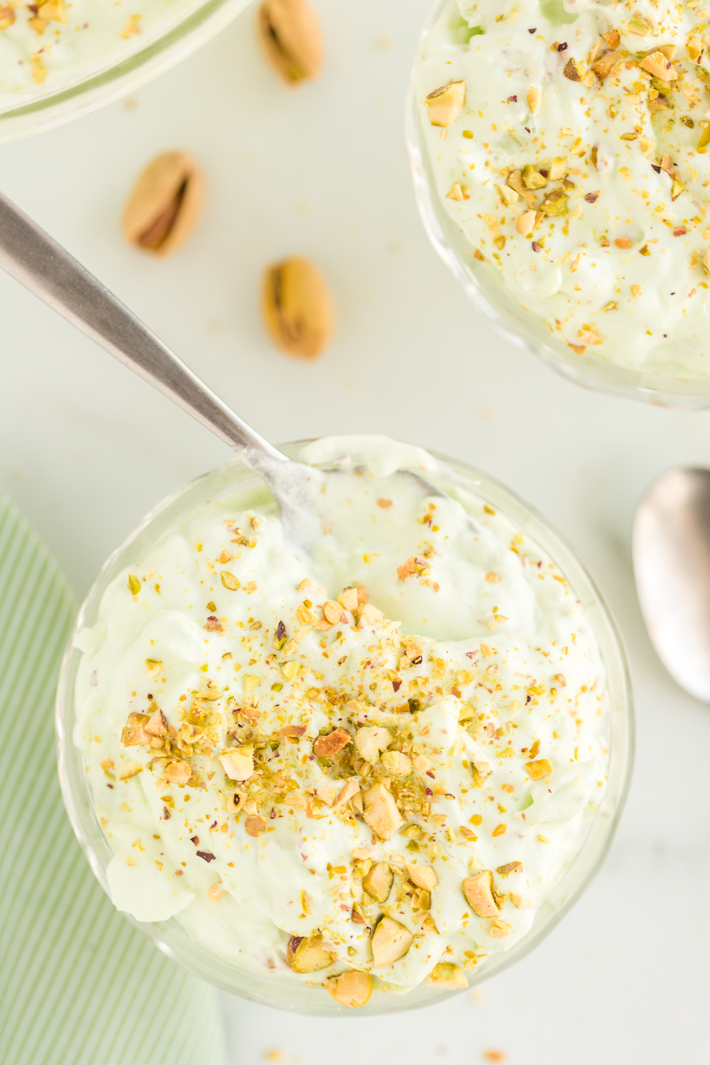 Pistachio Pudding Salad - pistachio pudding, crushed pineapple, and Cool Whip makes this a cool and refreshing pudding treat that will be a hit at any gathering!