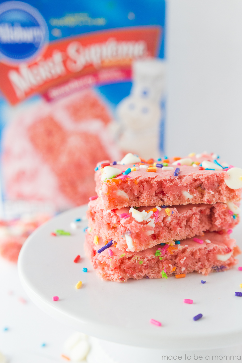 Strawberry Cake Mix Brownies: a fun and simple treat idea by using a cake mix. These strawberry brownies are bursting with color and only requires 4 simple ingredients