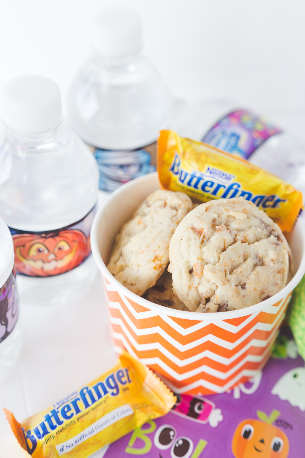 These Butterfinger cookies are soft, flavorful and delicious! They have a sweet taste and are filled with crunchy candy pieces! They are perfect for a Boo Basket. www.madetobeamomma.com