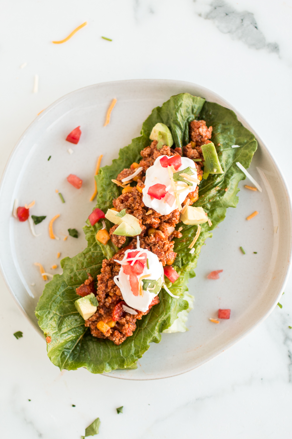 These Turkey Taco Lettuce Wraps are a delicious and low carb meal you can enjoy all year round! Top with your favorite taco toppings and it's a perfect family friendly meal. 