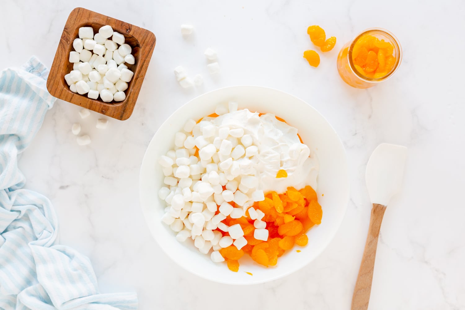 marshmallow, mandarin oranges in mixing bowl