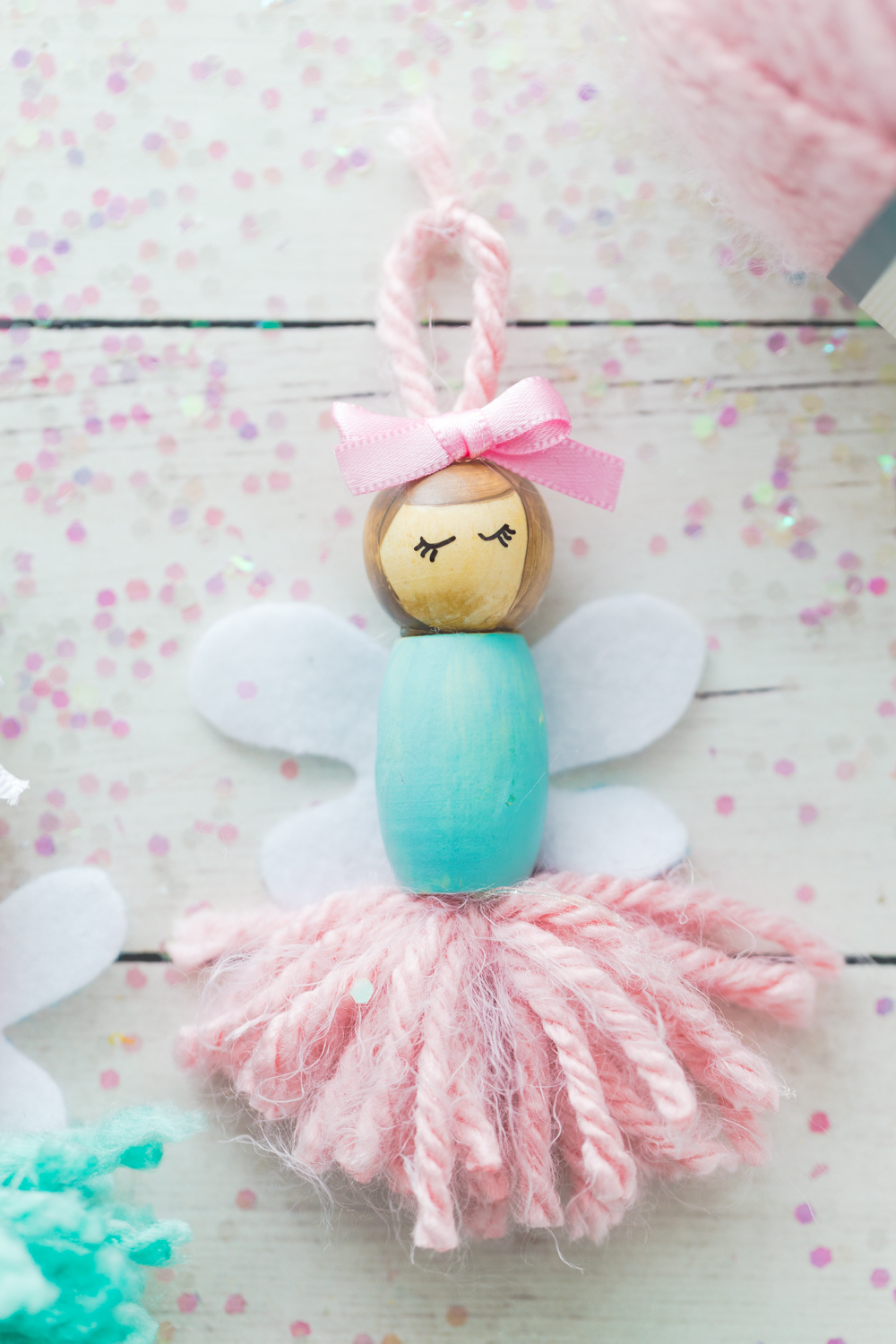 These Pom Pom Ballerina Fairies are the sweetest project for any little girl! They make great little bookshelf decorations or ornaments. 