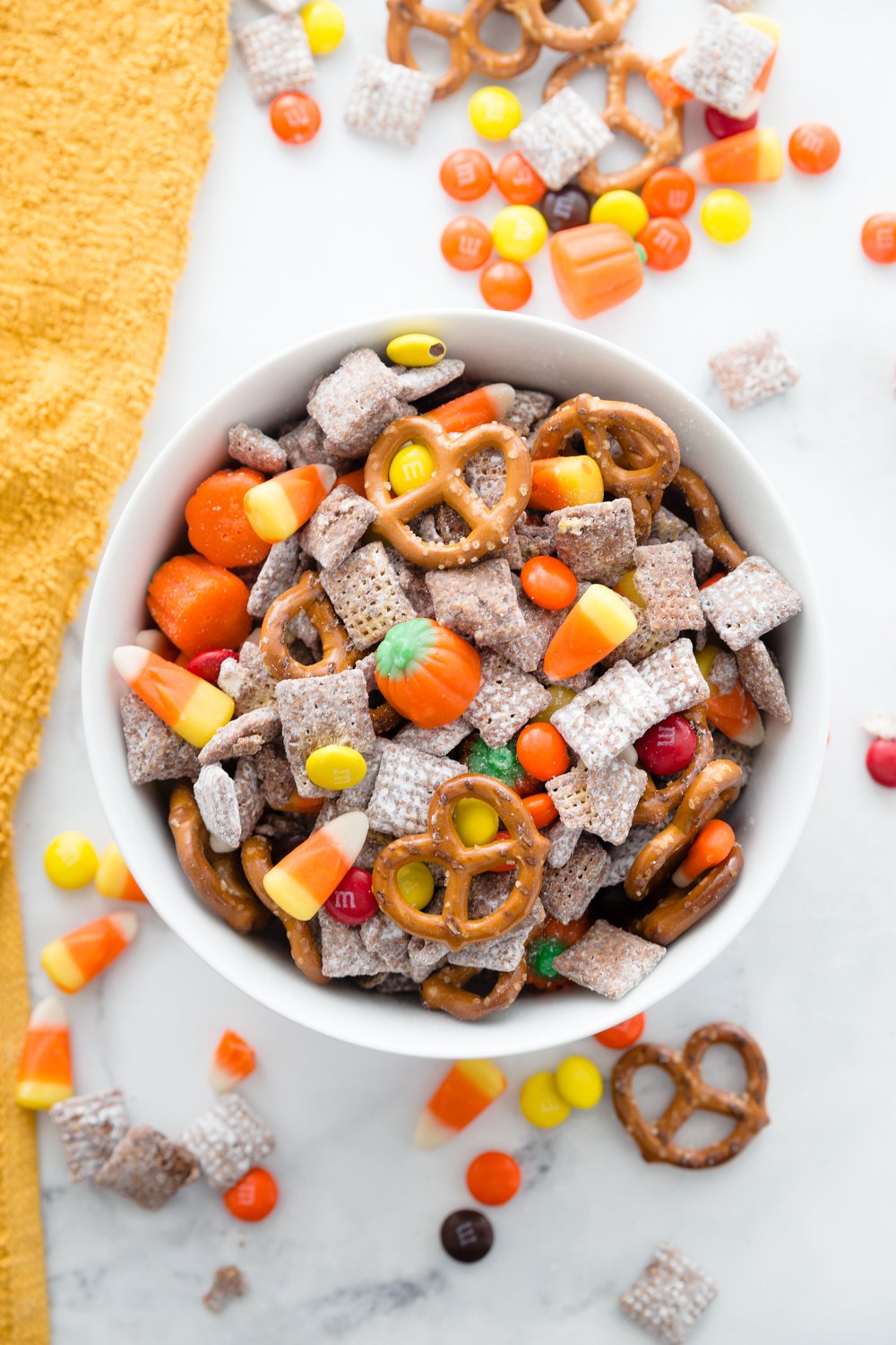 This Harvest Puppy chow is an easy fun fall treat!  It combines the classic flavors of puppy chow with some new ones! 