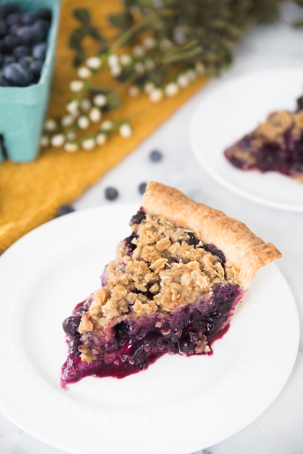 This Blueberry Crumb Pie is bursting with a sweet berry filling and topped with a crunchy crumb crust.  It's the perfect amount of crunch with the juicy berries.