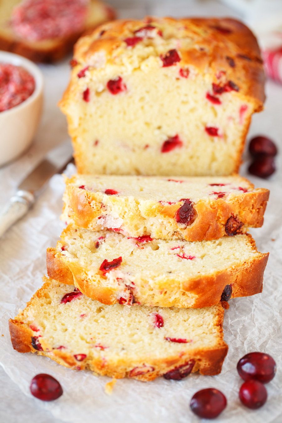 This Cranberry Bread is a delicious bread filled with fresh cranberries and topped with a delicious cranberry butter! Perfect for your Thanksgiving table!