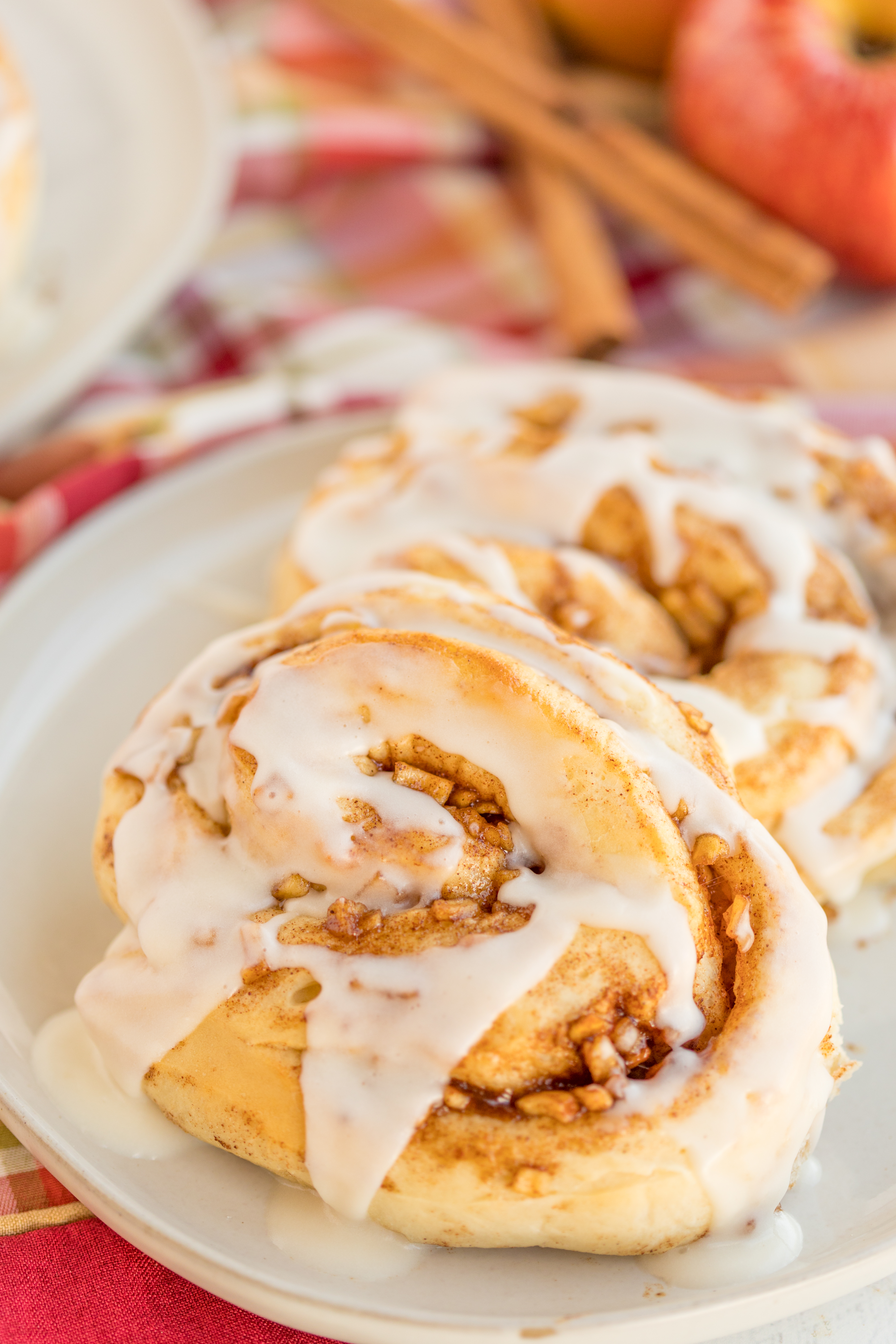 Apple Pie Cinnamon Rolls are a delicious twist on the classic cinnamon roll.  Spices like cinnamon, brown sugar, and bits of apples makes this a delicious fall dessert.