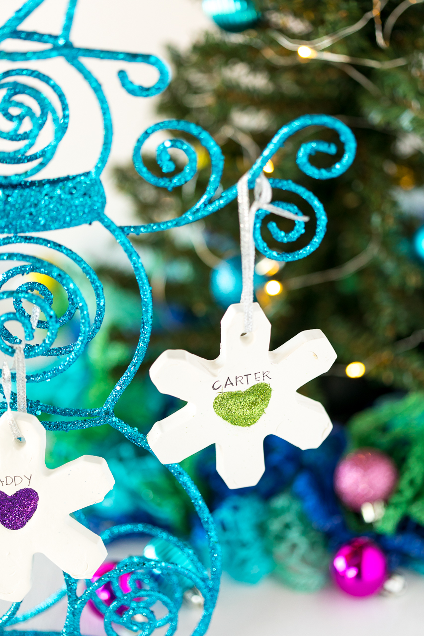 These Thumbprint Snowflake Ornaments are such a fun DIY kids ornament.  All you need is some modeling clay, glue, and glitter. 