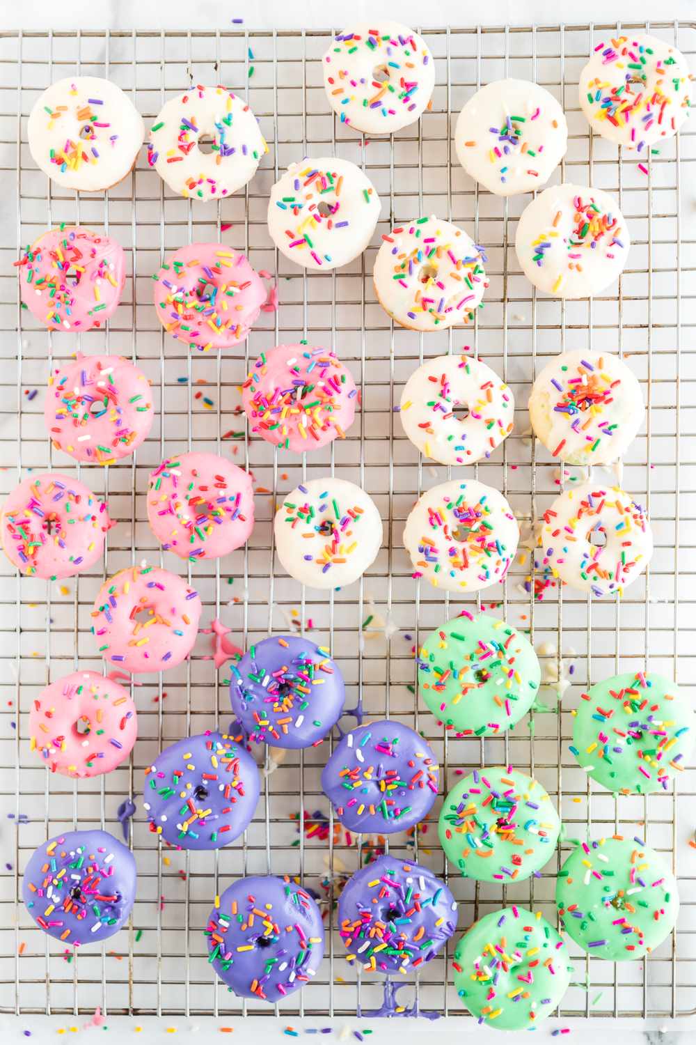 different colored iced funfetti cake mix donuts