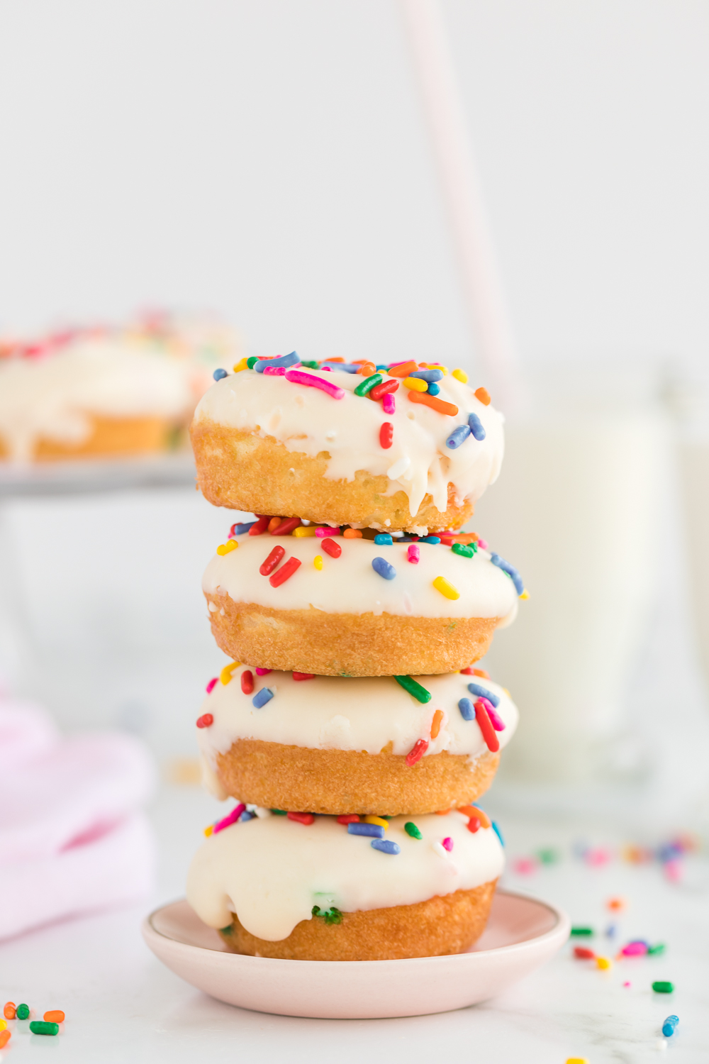 Mini Funfetti Cake Mix Donuts: a delicious and fun treat the kids will love to make and eat! You only need a Funfetti cake mix, sprinkles, and some icing to make this colorful treat. 