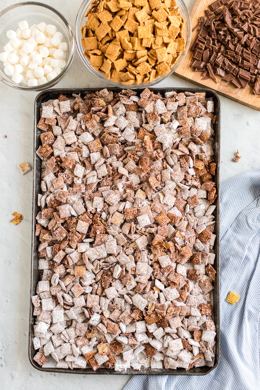 S'mores Puppy Chow:  chocolate and peanut butter coated cereal is mixed with mini marshmallows, graham crackers and chocolate for a delicious summer treat that's a twist from a classic puppy chow recipe. 