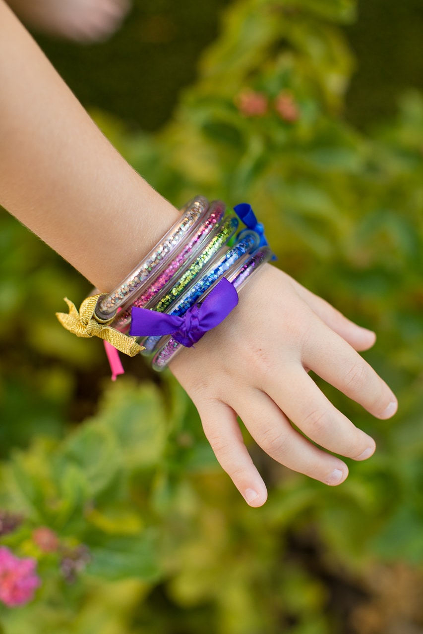 glitter bracelets on childs wrist
