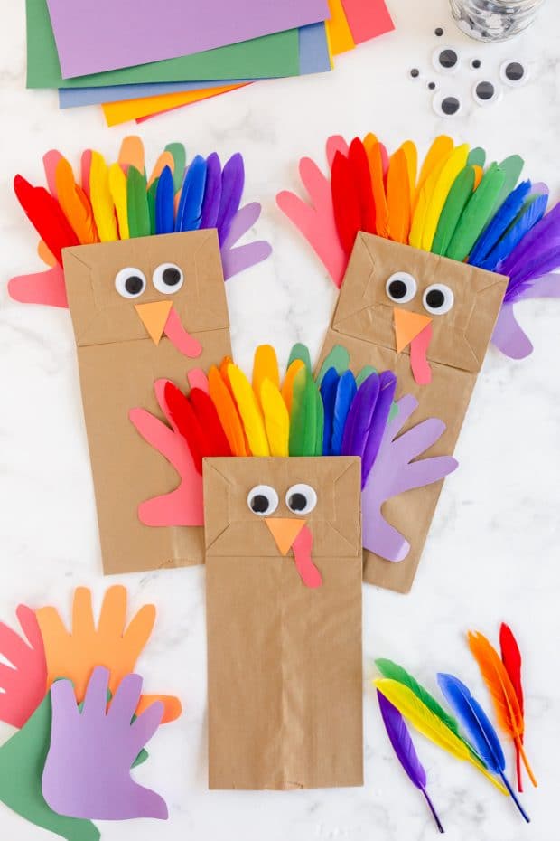 Paper Bag Turkey Craft is a fun Thanksgiving craft the kids will love to do! Bright colored feathers, paper handprints and silly googly eyes make for a fun project!