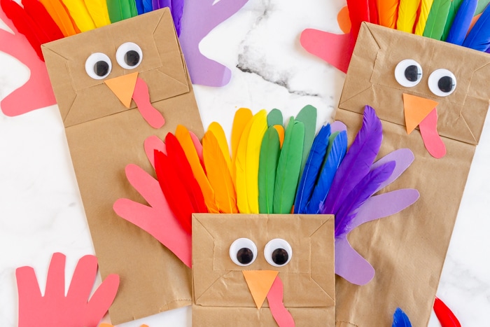 rainbow feathers on paper bag craft