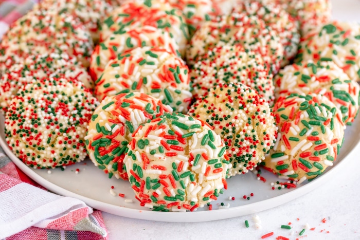 close up photo of christmas jimmie sprinkles on cookies