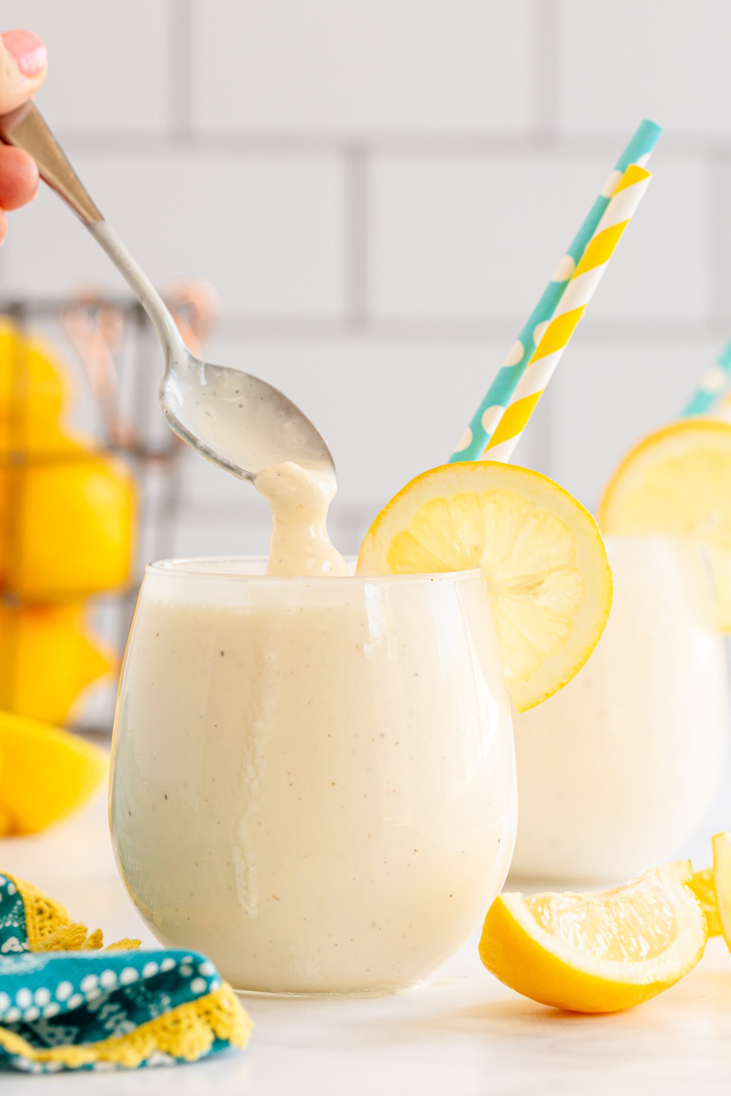 spoonful of frosted lemonade in serving glass