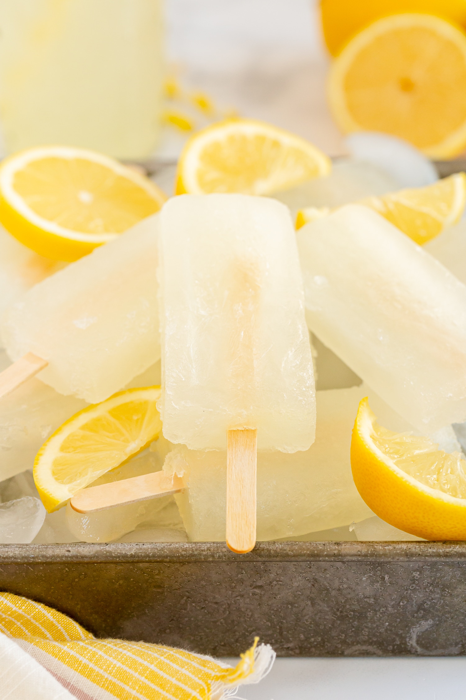 lemonade popsicles in a dish with ice