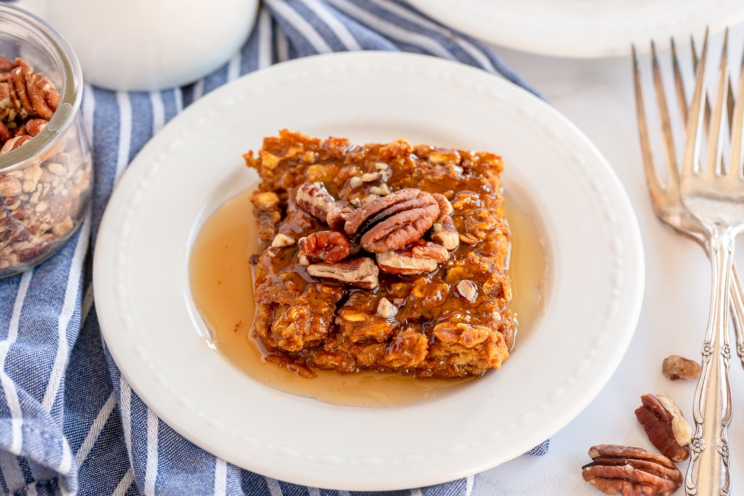 pumpkin pie oatmeal on serving plate with pecans