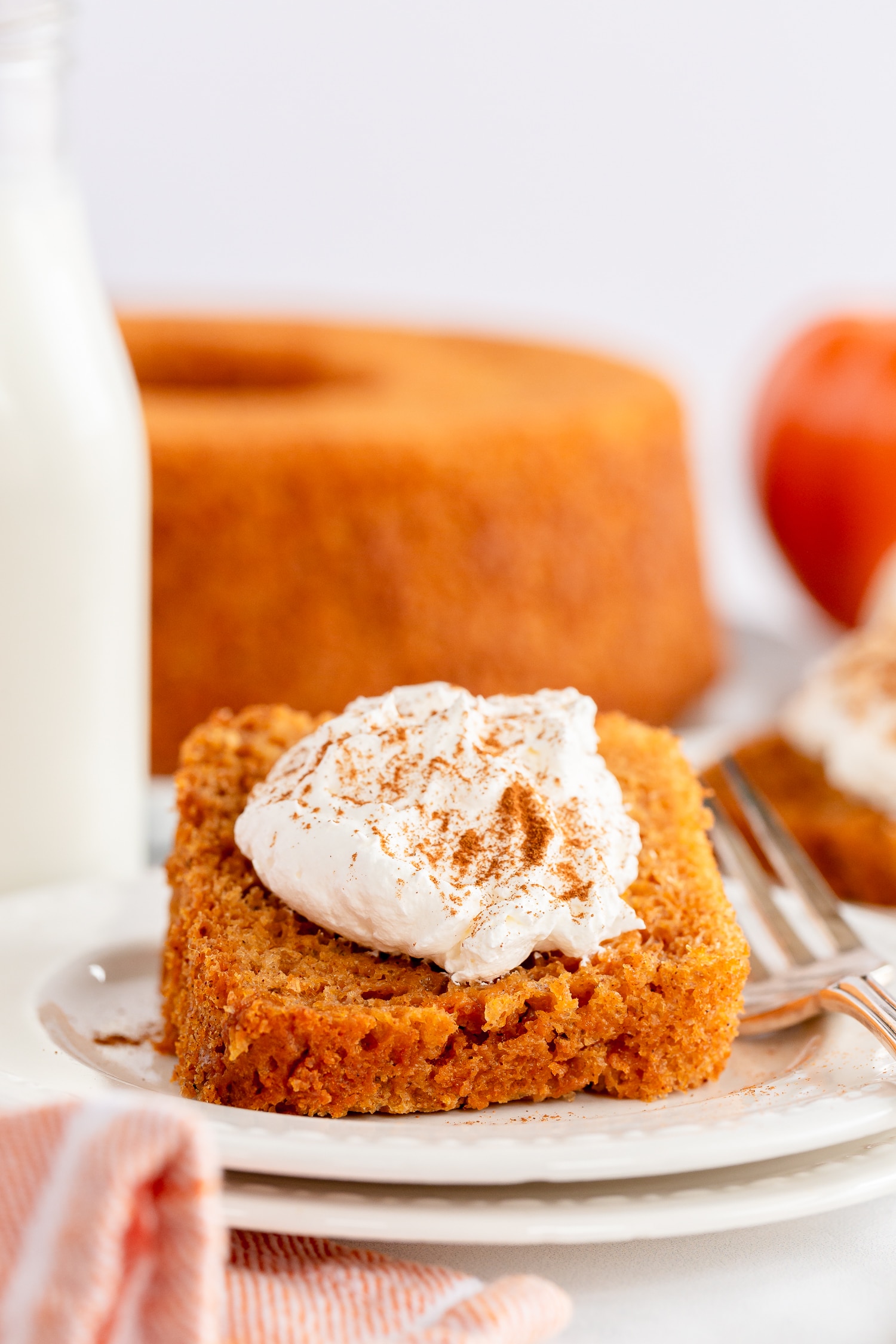 pumpkin angel food cake with dollop of whipped cream