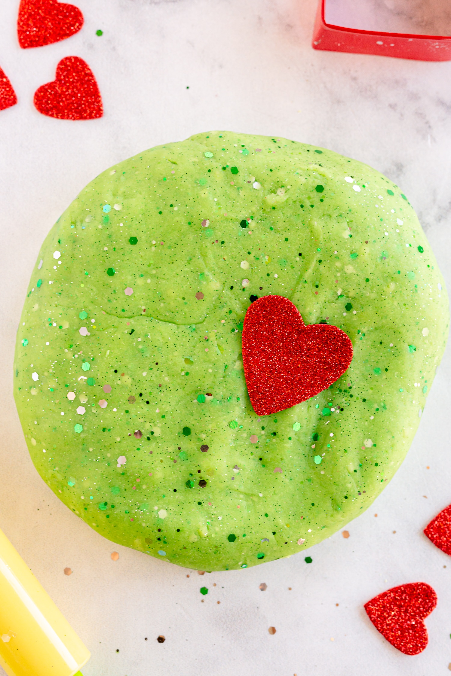 Grinch Playdough with glitter and red foam hearts