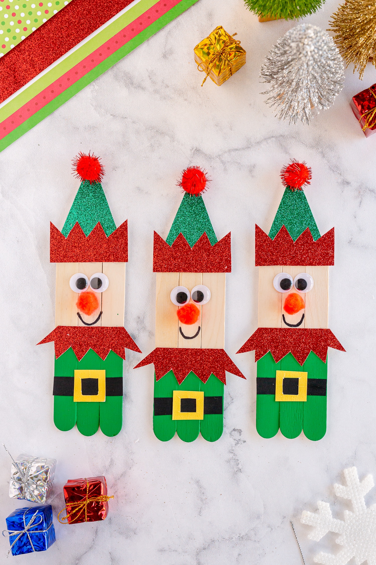 finished popsicle stick elves in a row