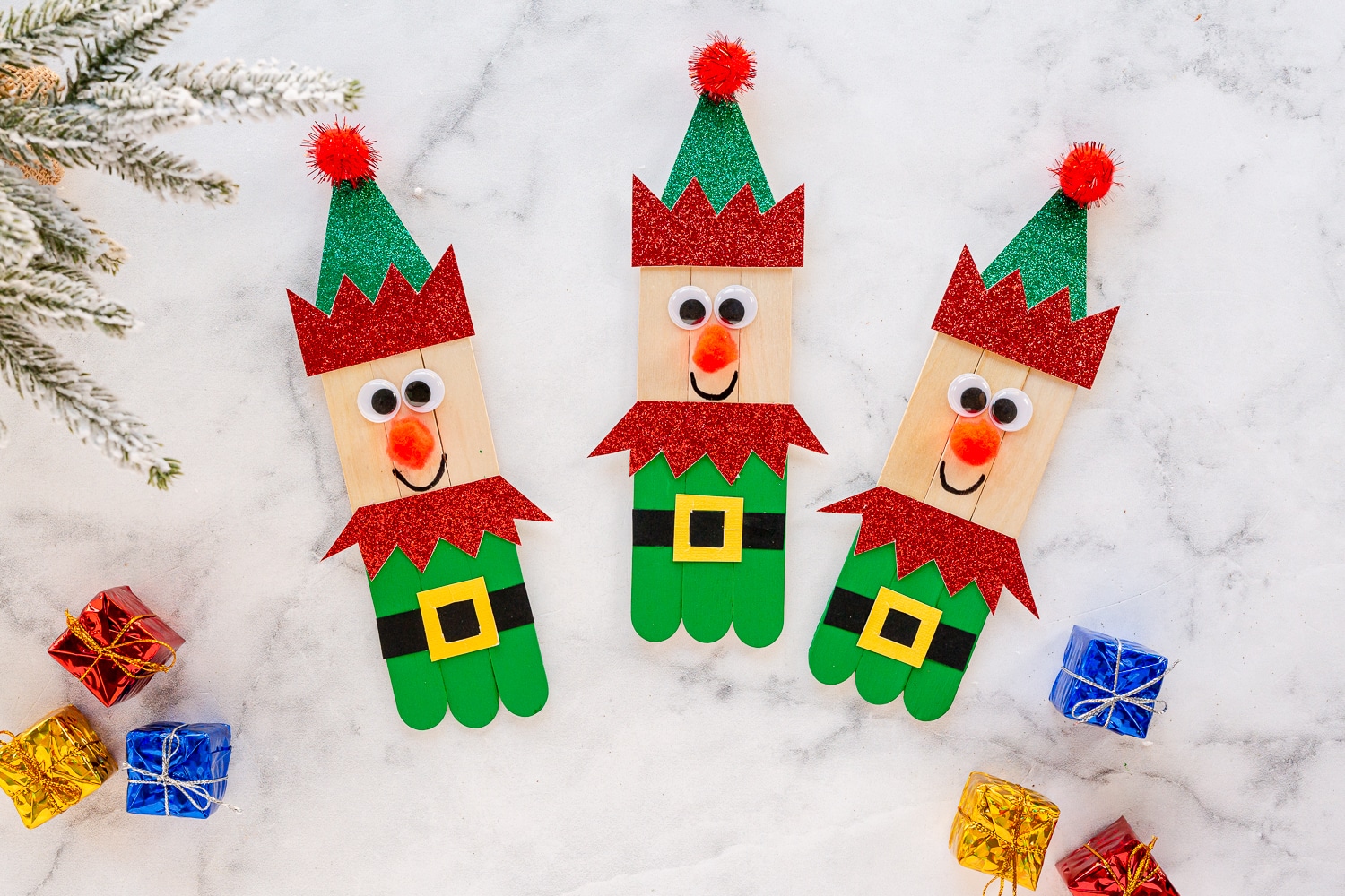 jumbo popsicle stick elves completed with small gift props