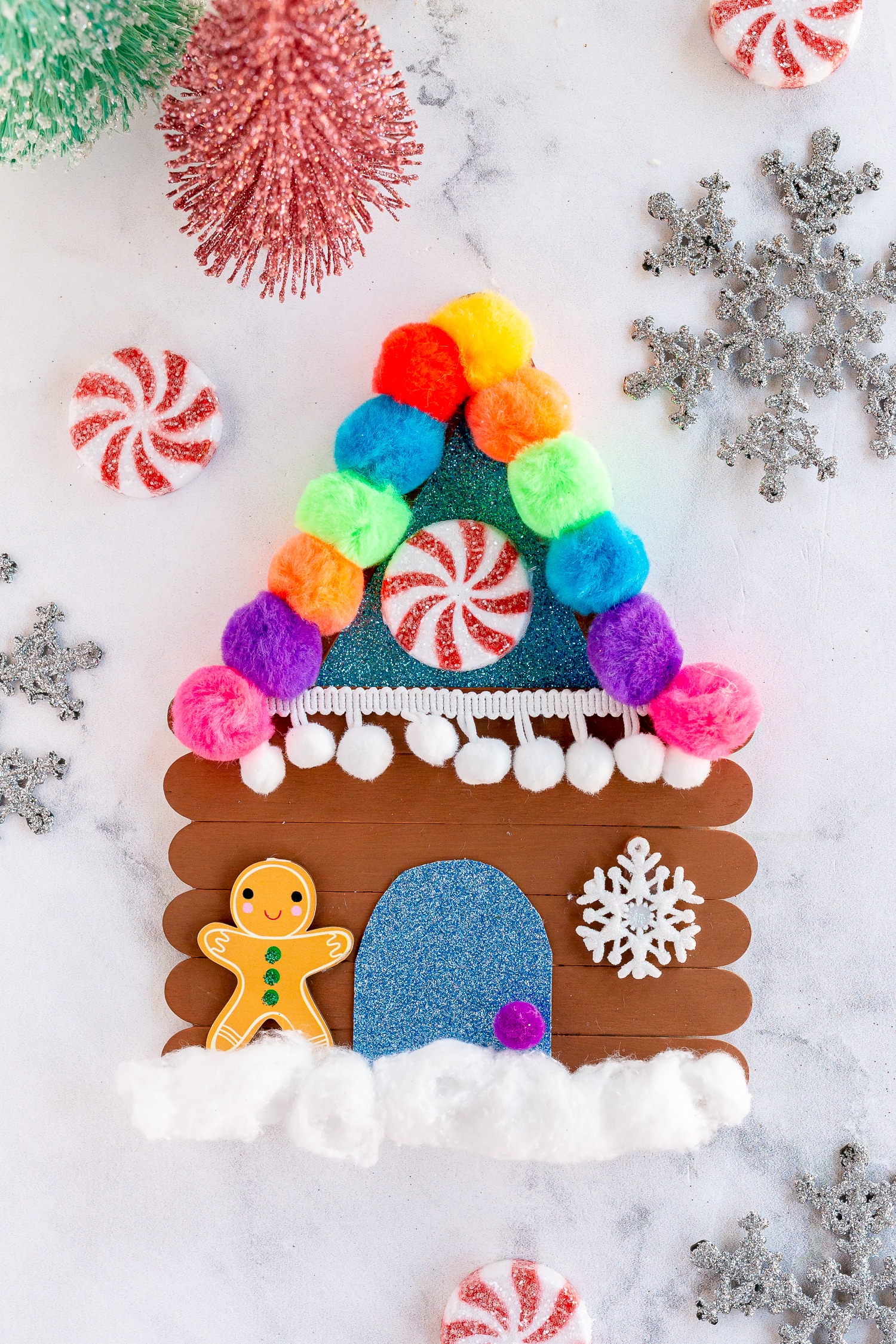 finished gingerbread house with mini decoration pieces
