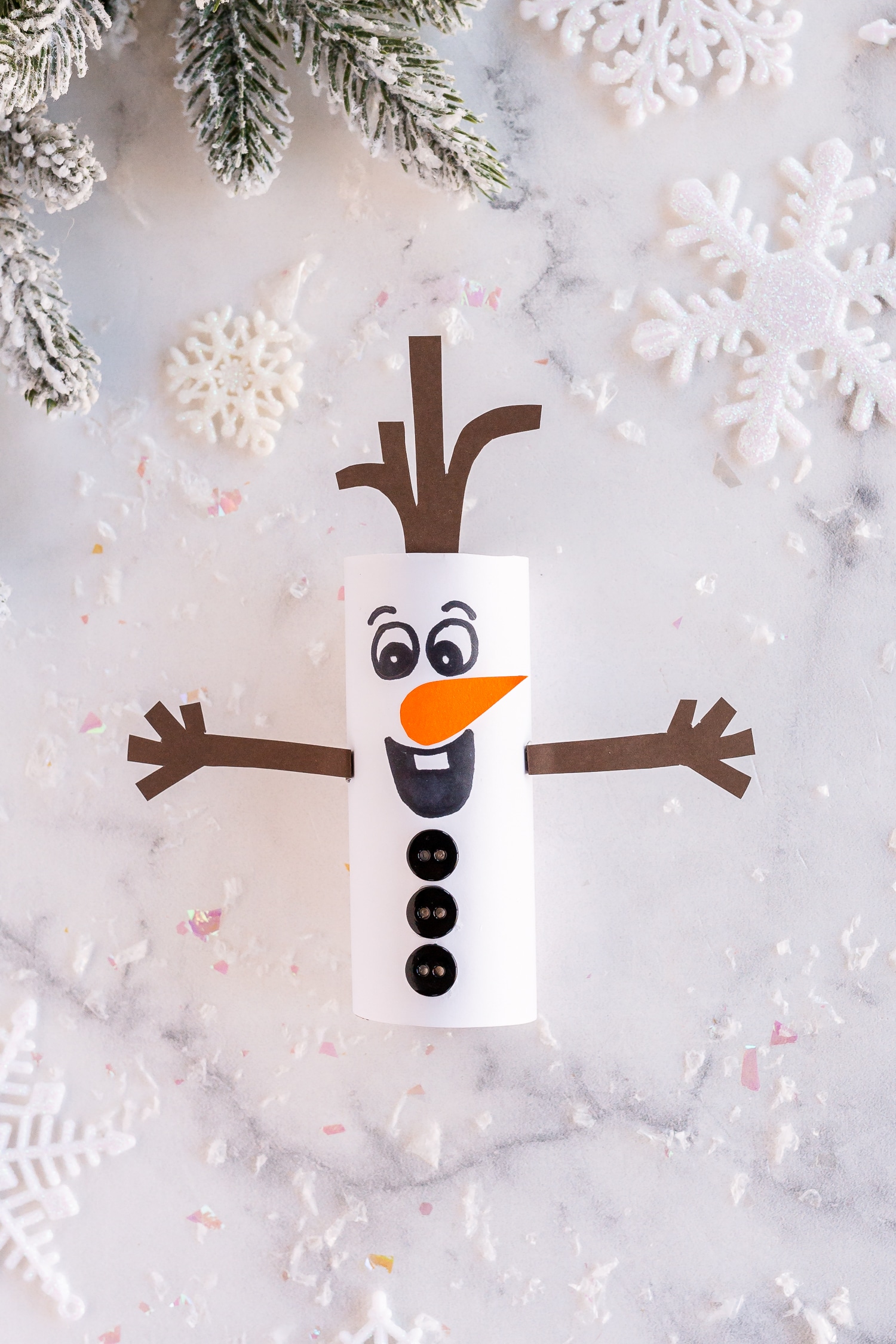 Enjoy a snow theme craft with this cute Toilet Paper Roll Olaf! It's so easy to make, and your kids will love the Frozen theme!