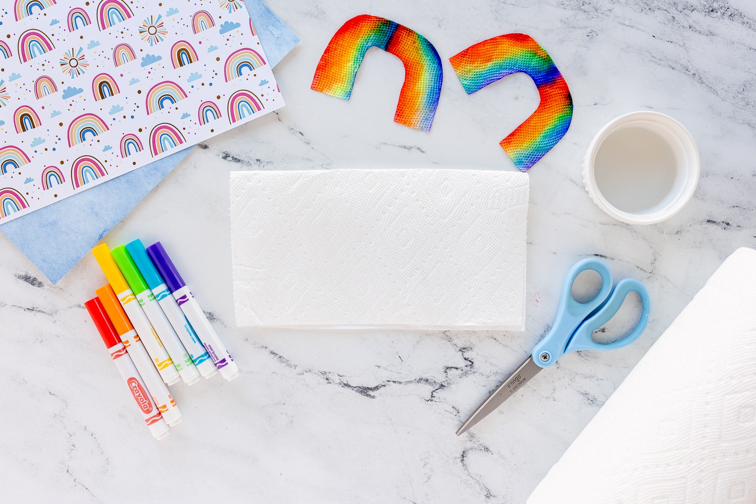 supplies needed to grow a rainbow on counter - markers, paper towel, water