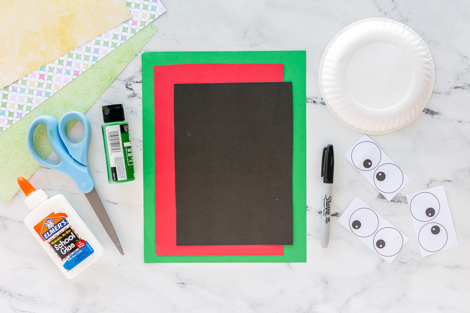 supplies needed for paper plate frog craft on kitchen counter
