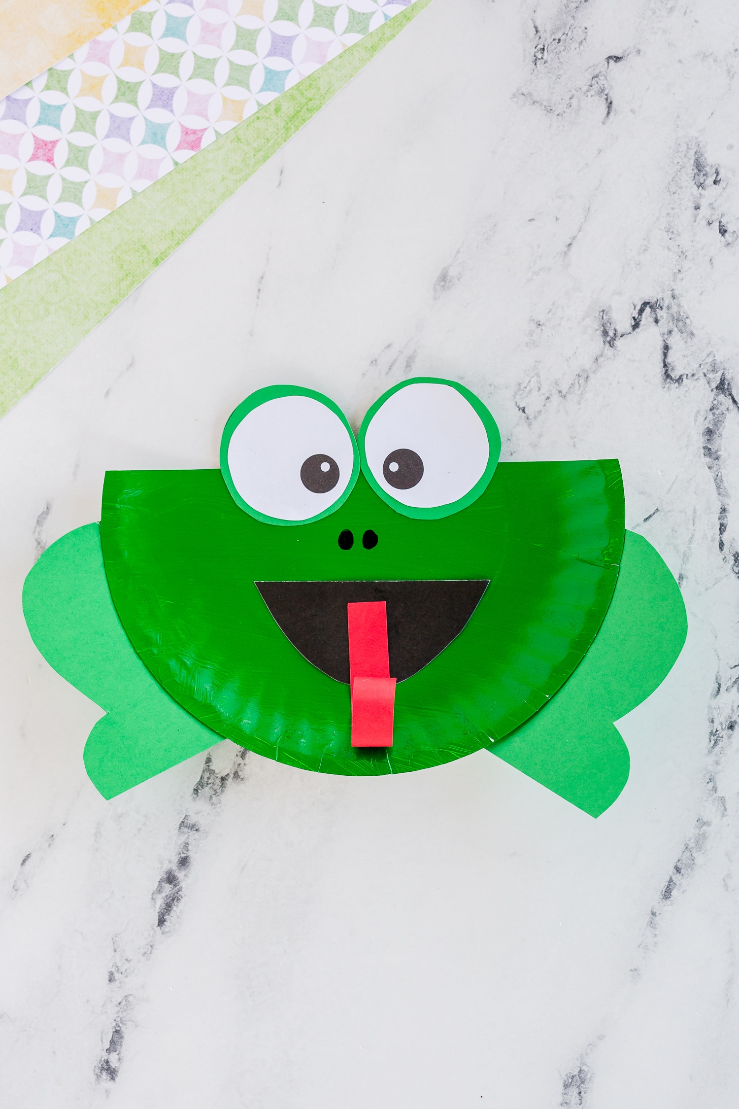 one finished paper plate frog