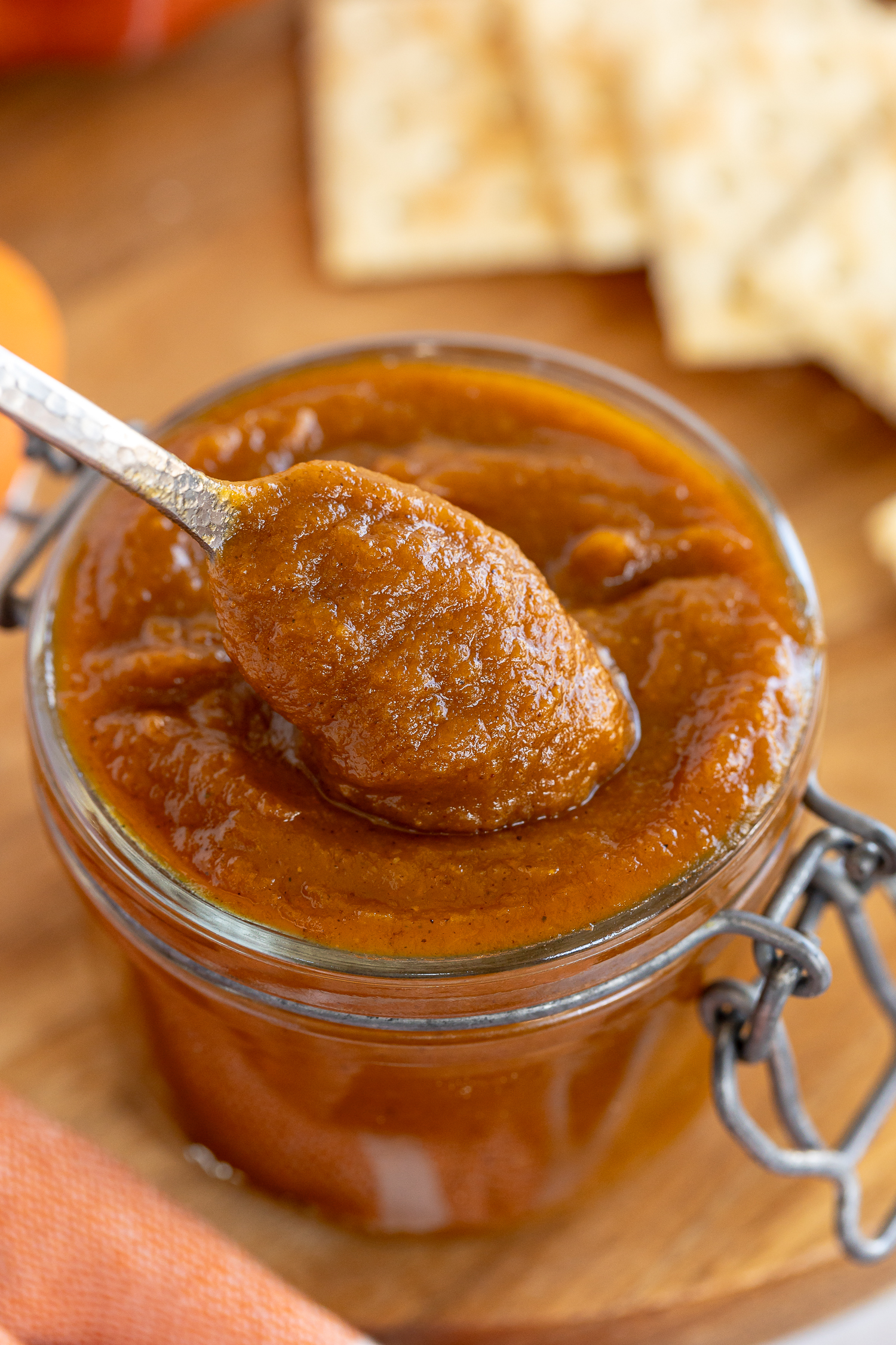 pumpkin butter in glass jar with spoonful