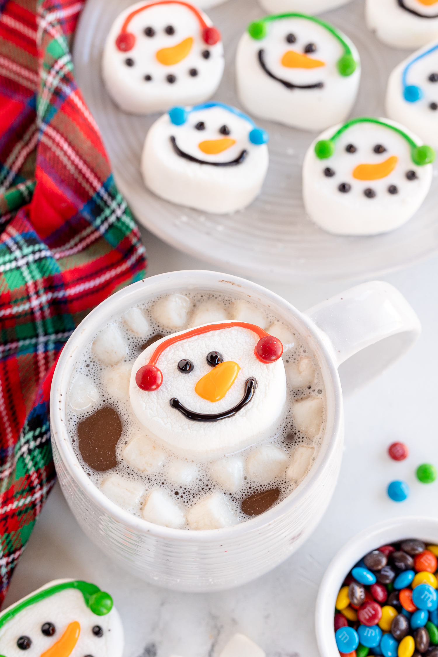 marshmallows snowman in cup  of hot  chocolate