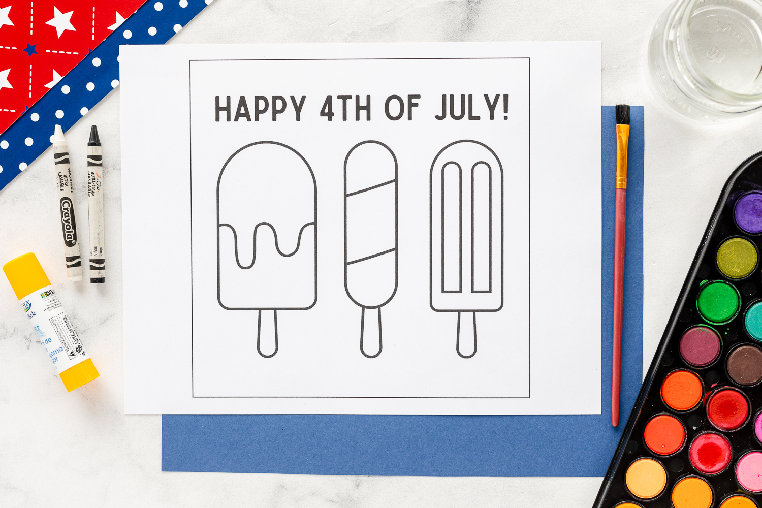 Fourth of July Watercolor activity printable on counter with watercolors and cardstock