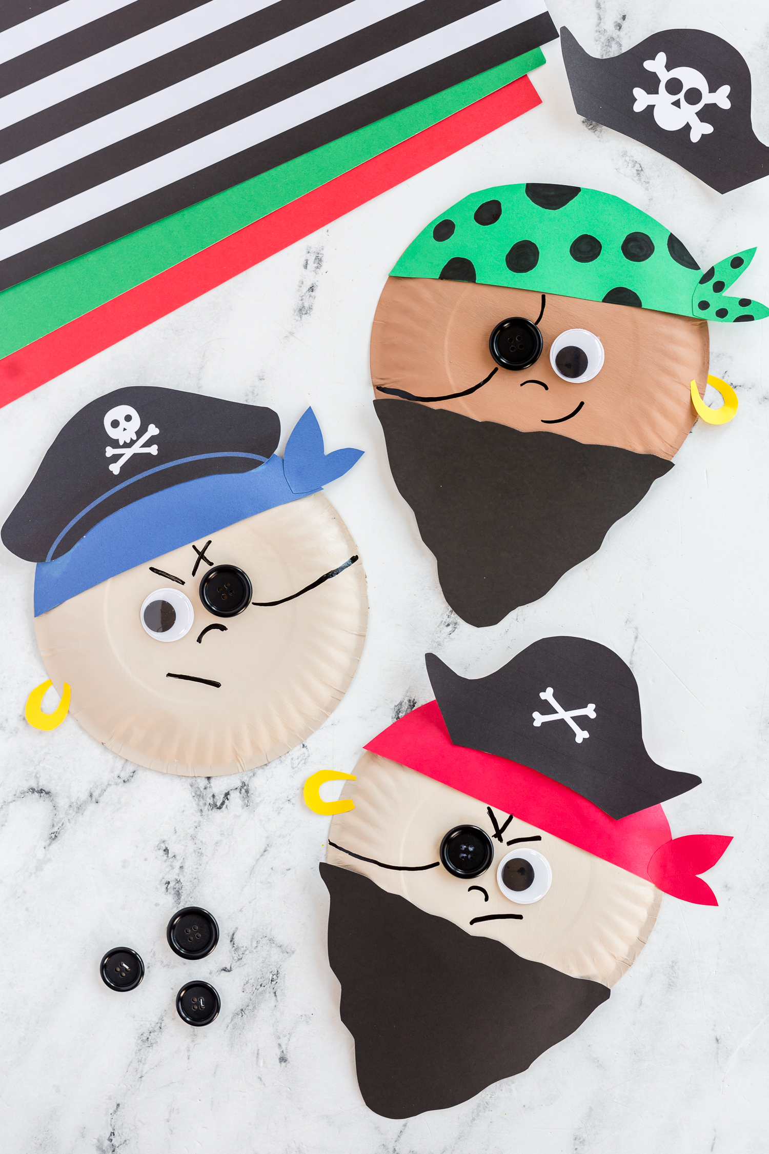 paper plates painted shades of brown, paper beards and pirates hats glued on