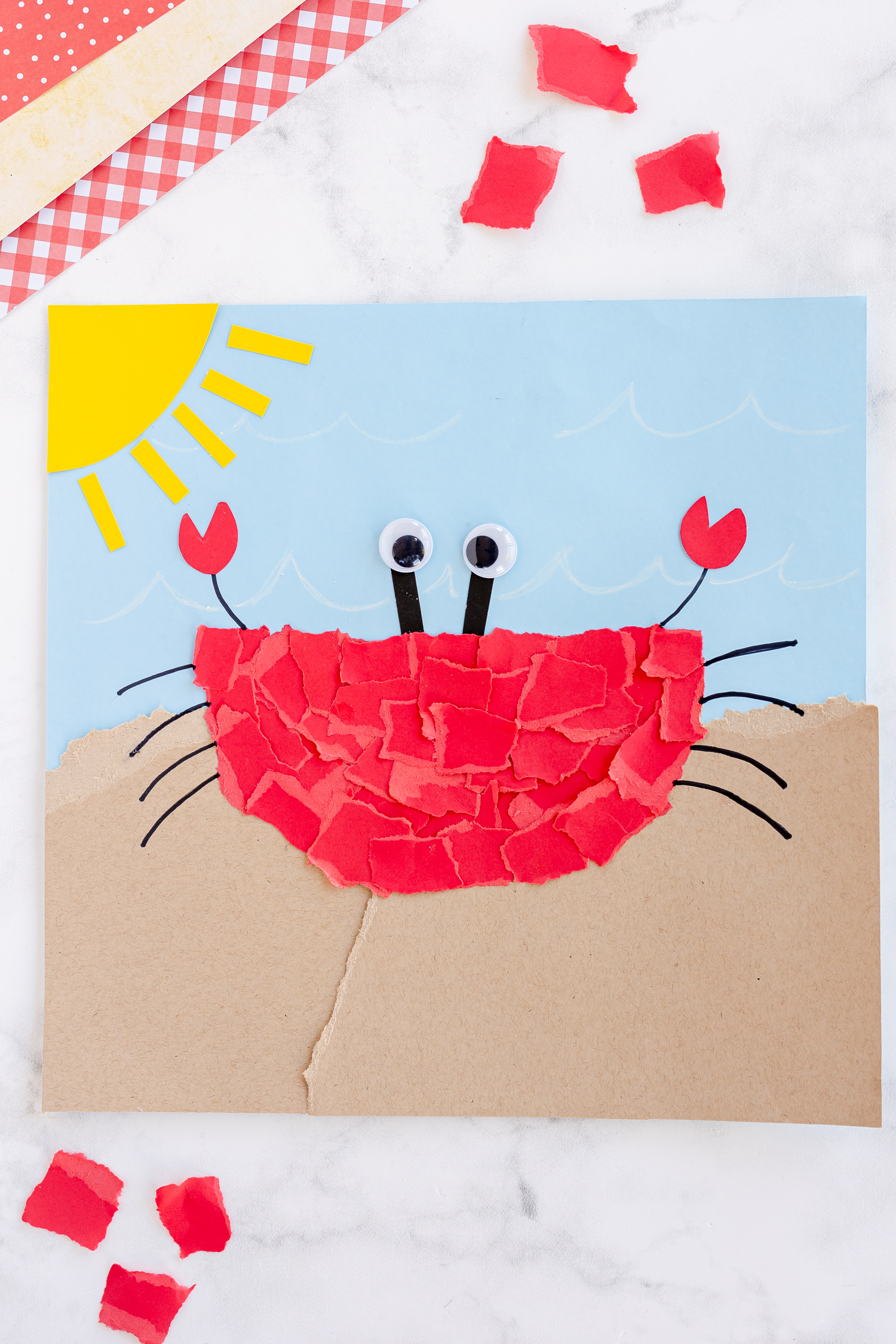 torn paper crab craft on craft counter