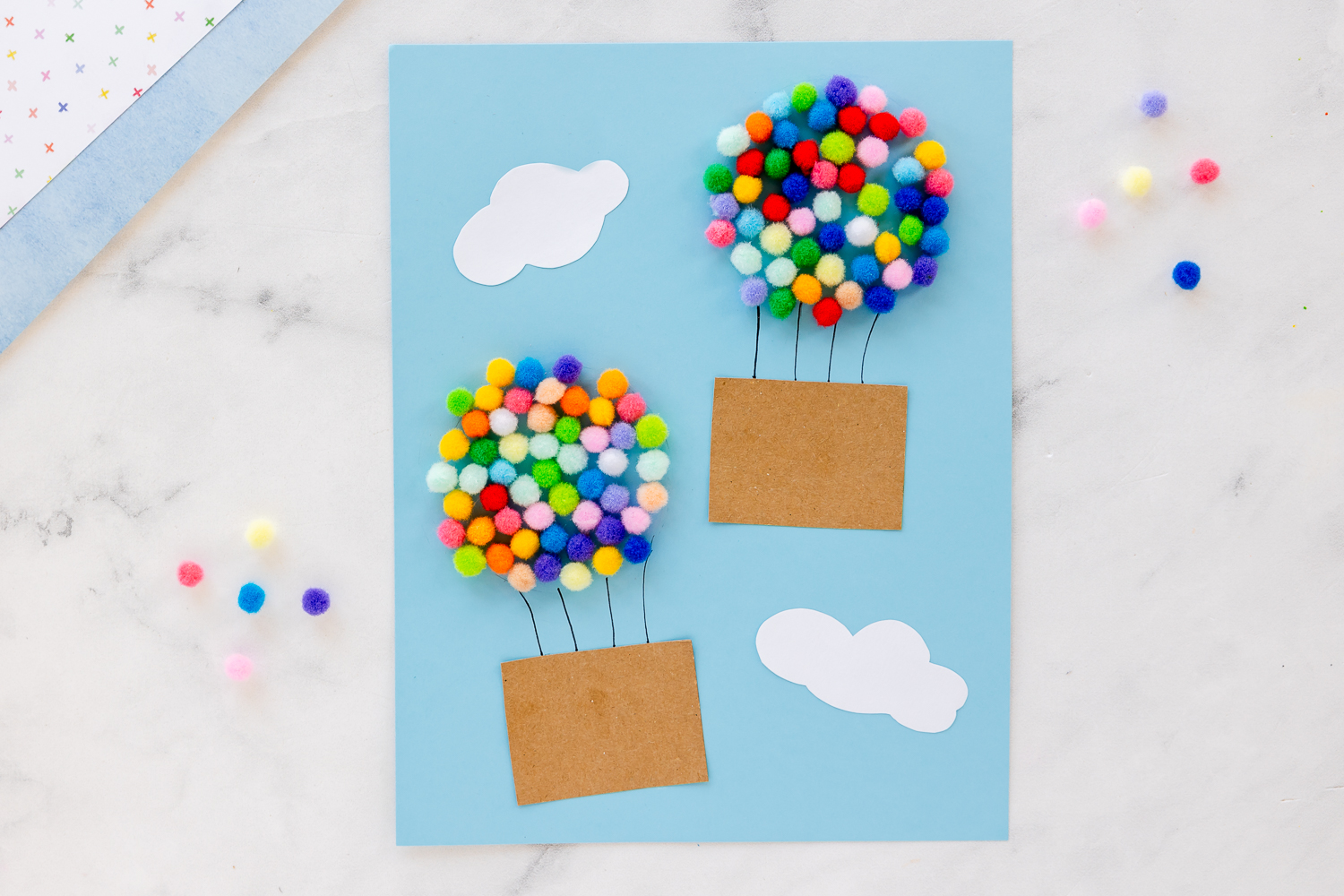 colorful pom poms in shape of hot air balloon