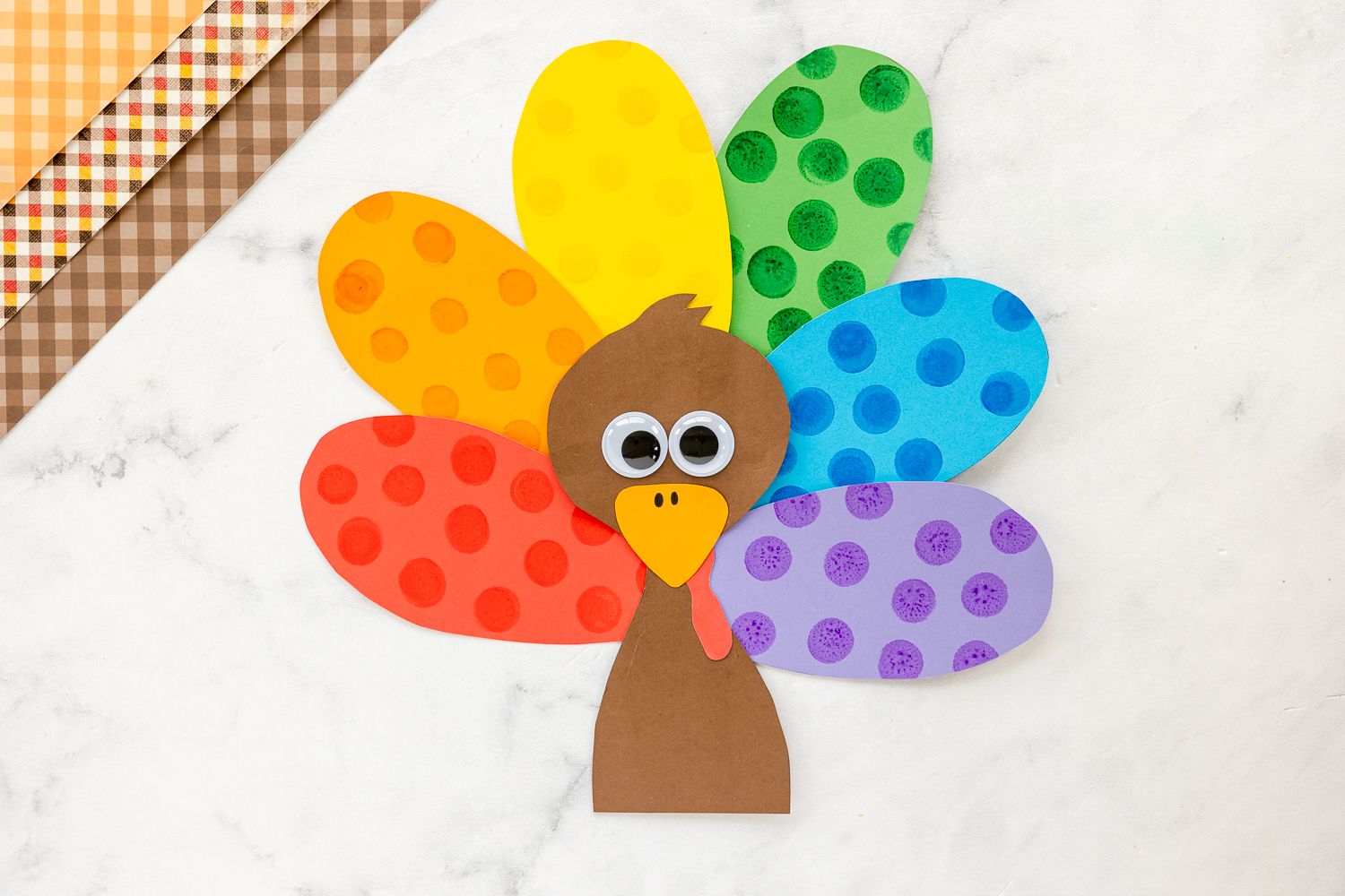 finished turkey  craft on kitchen counter with  brown paper beside it