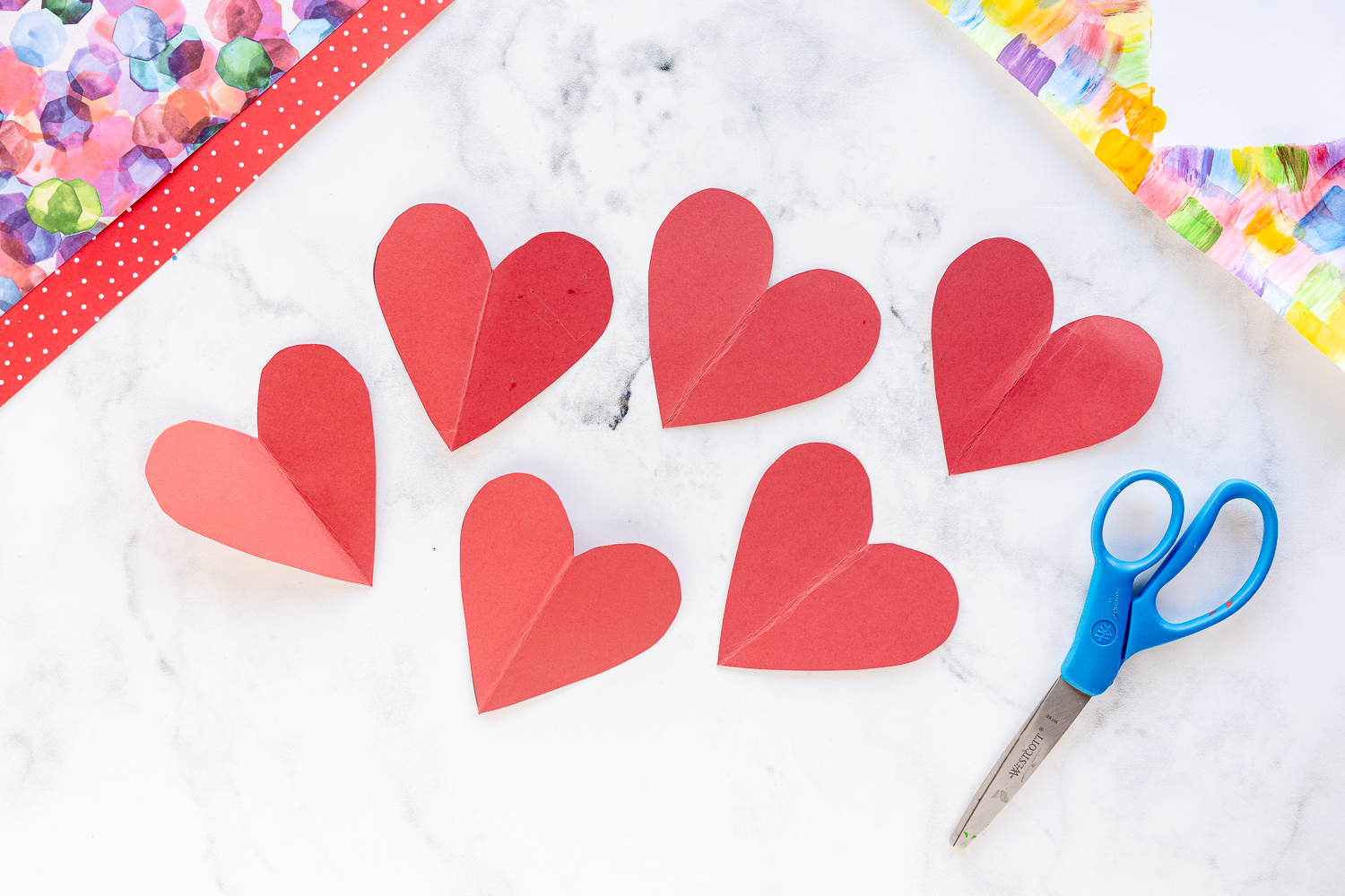 cut out hearts from red paper