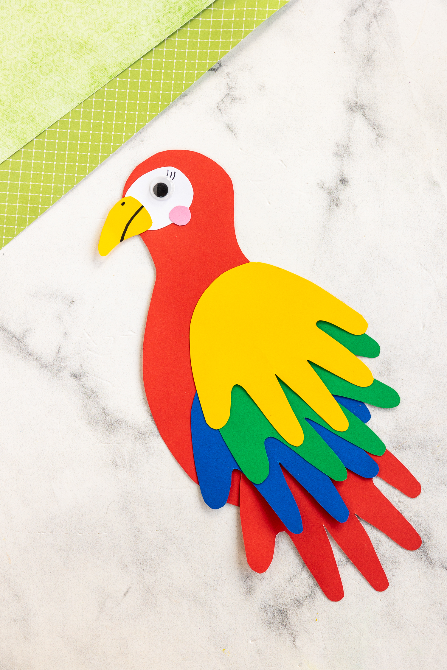 finished paper parrot handprint craft