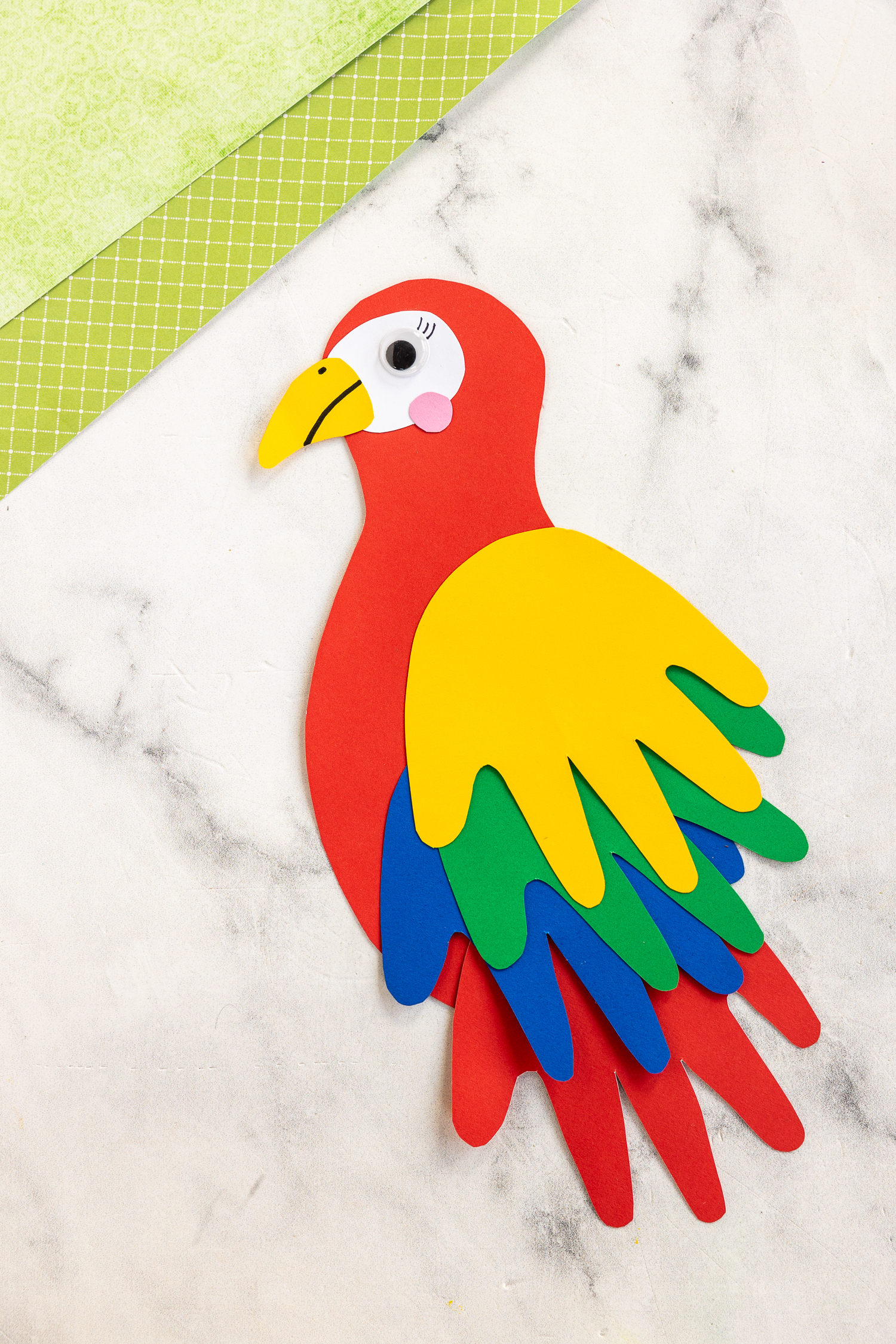 handprint parrot craft finished on craft counter