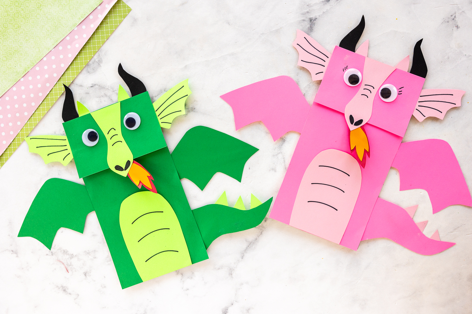 green and pink dragon craft made from brown paper bags