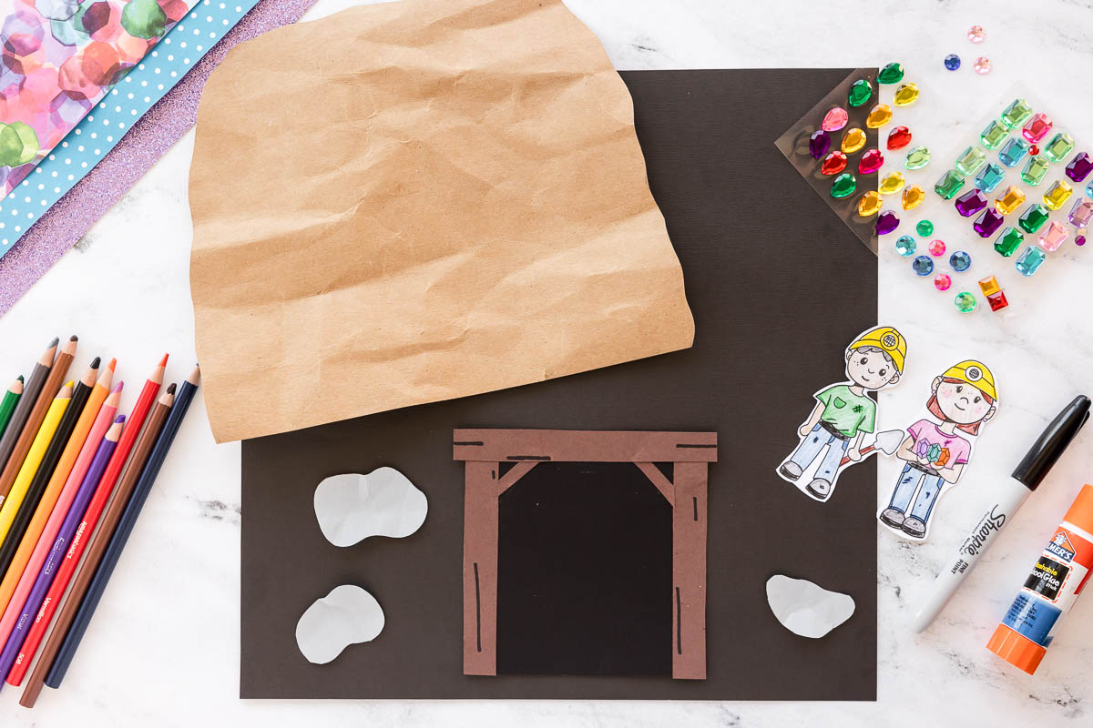Kids mining craft with cave entrance and paper rocks