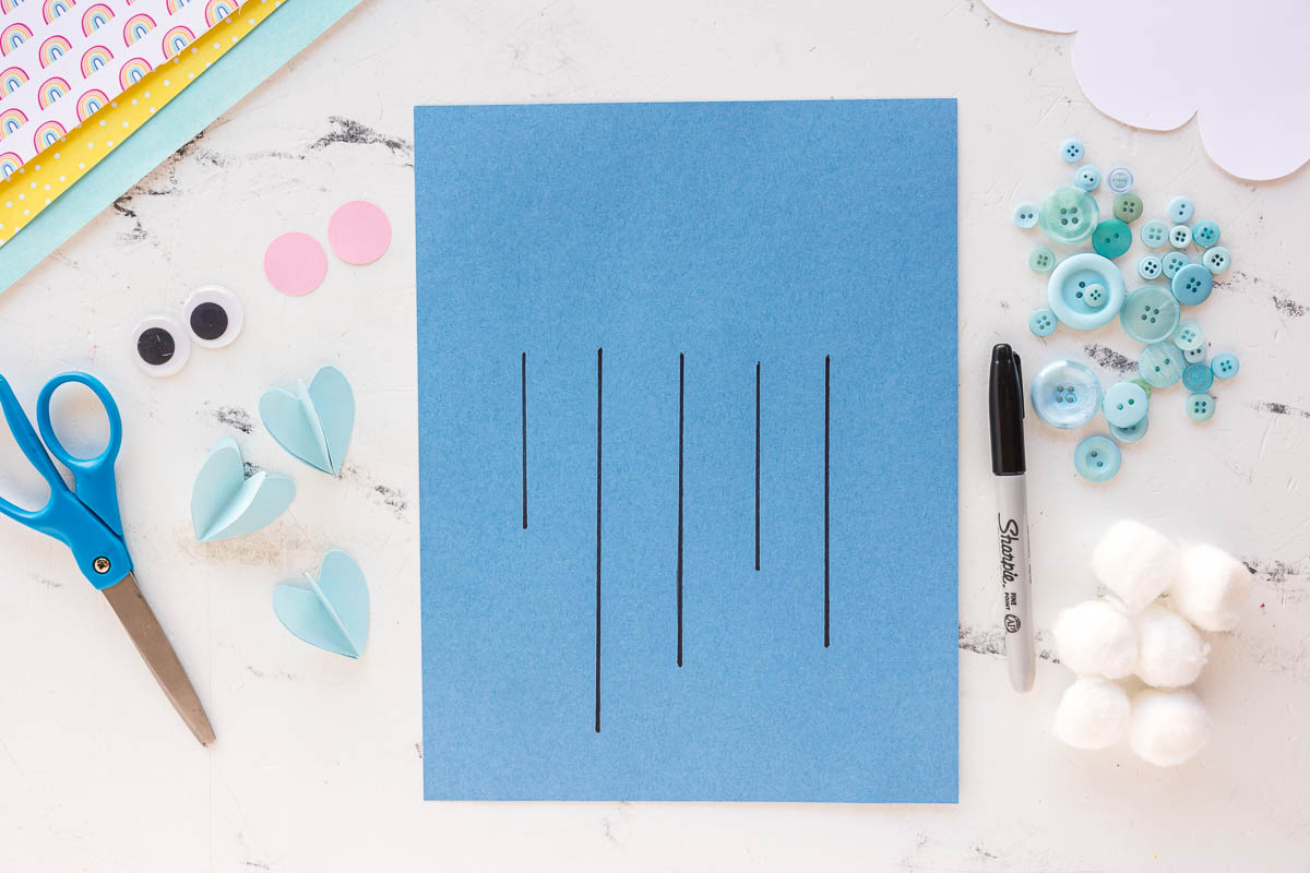 black lines drawn on paper for buttons and cloud shape
