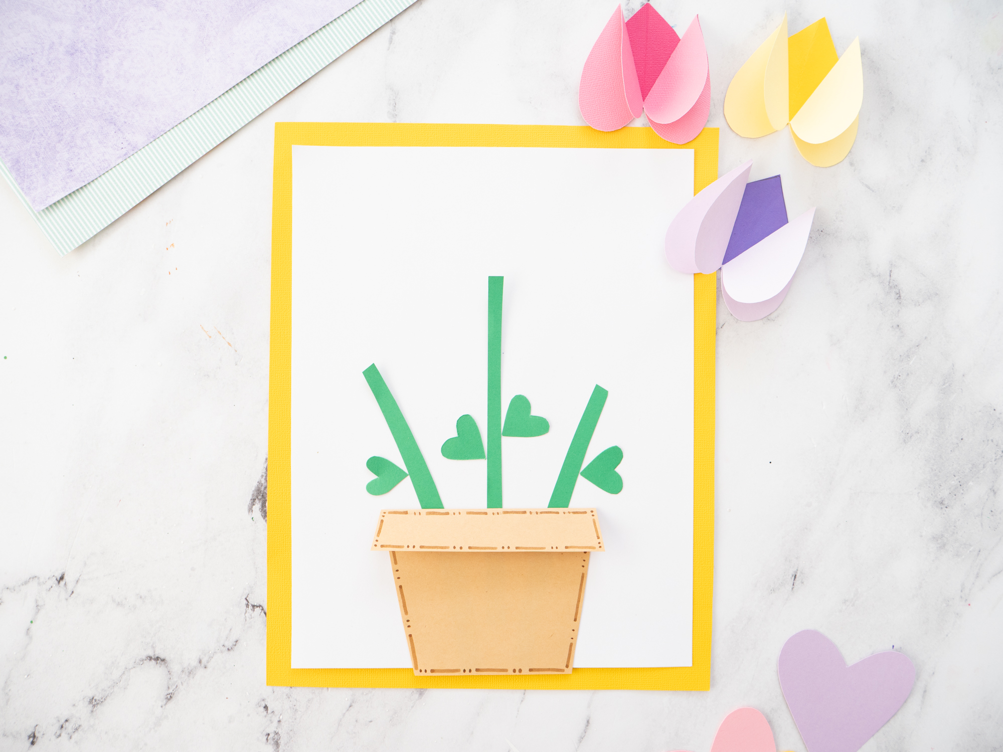 green paper stem glued to heart tulip