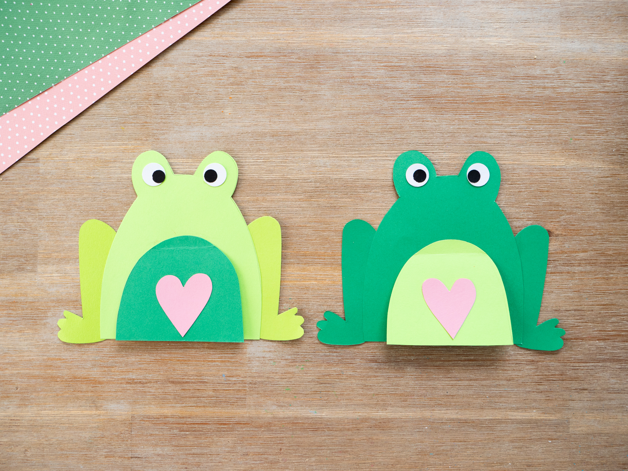 Gluing together frog craft card pieces for an easy Mother&rsquo;s Day craft for kids