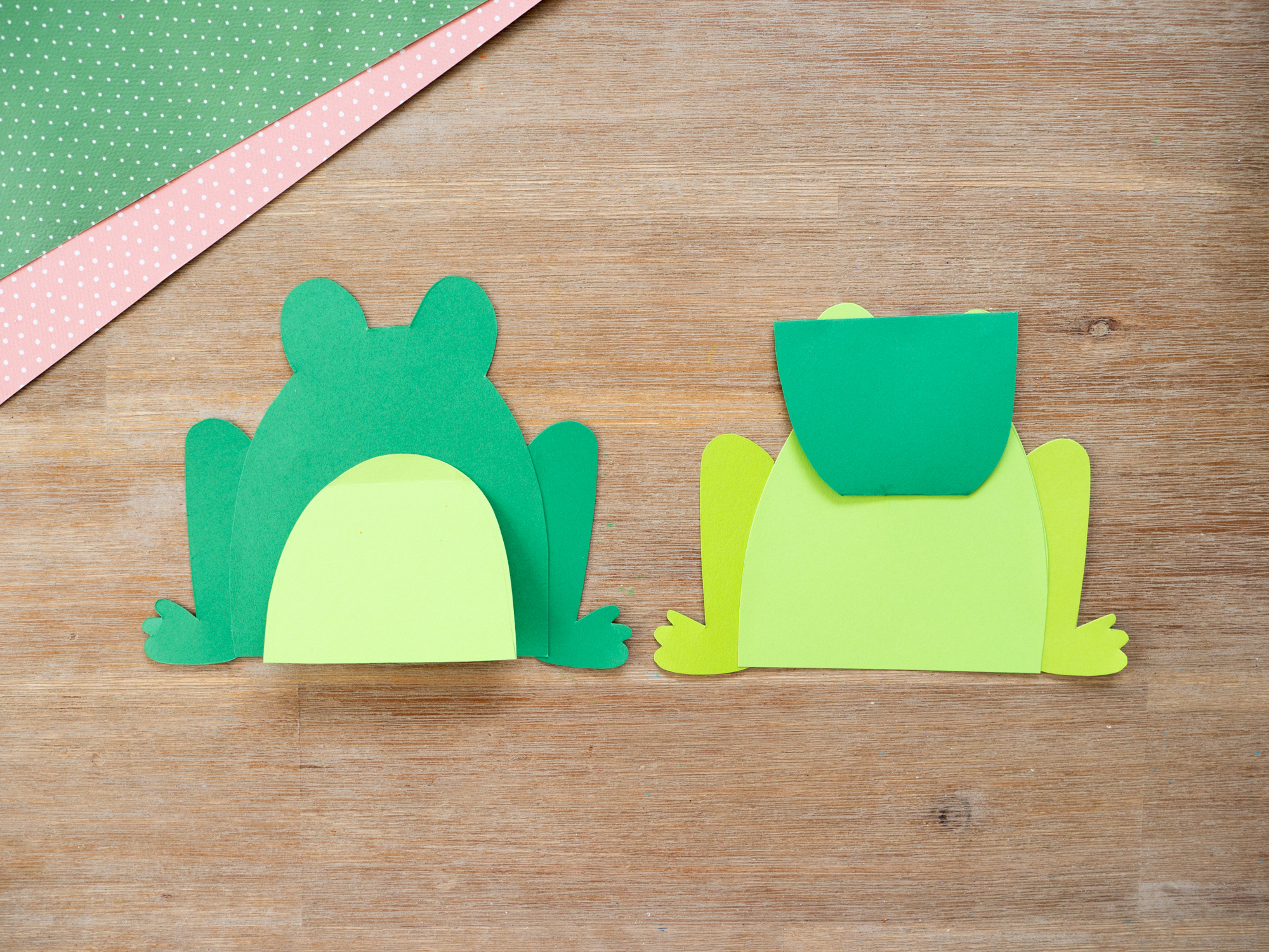 Gluing together frog craft card pieces for an easy Mother&rsquo;s Day craft for kids
